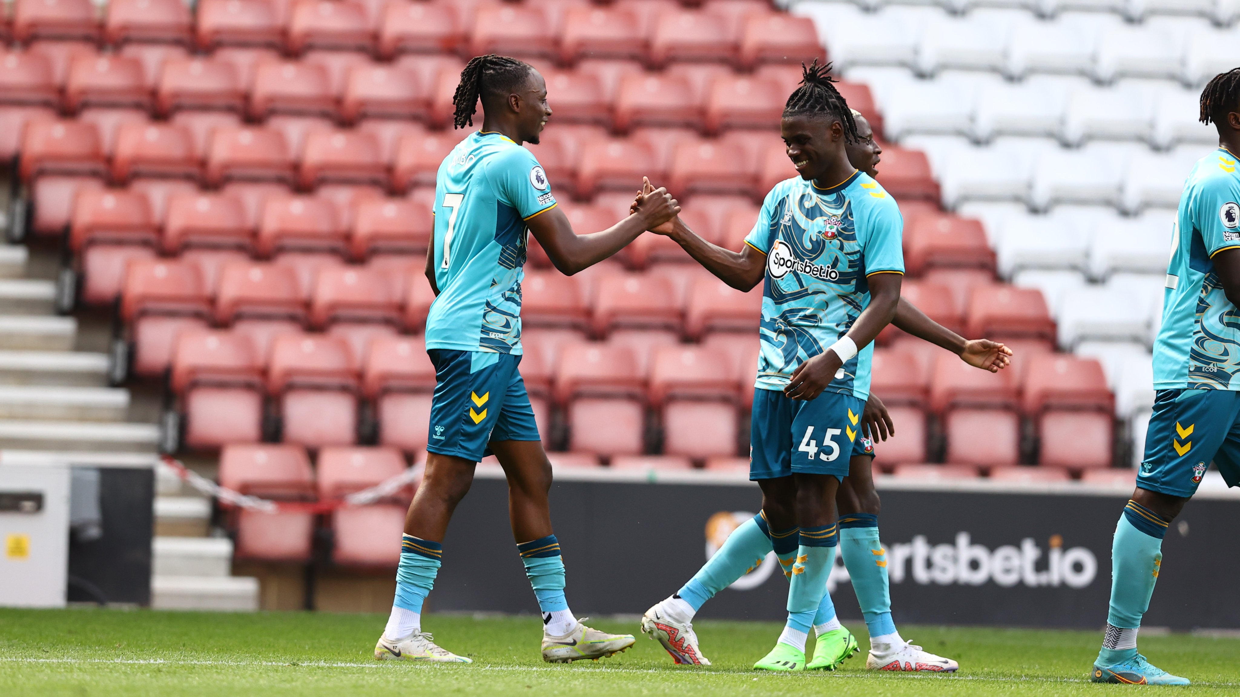 Joe Aribo celebrates his debut goal for Southampton against Villarreal at St Mary's with Romeo Lavia. 