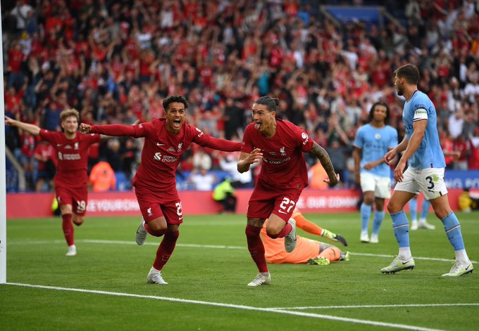 Darwin Nunez sprints away in celebration, with Fabio Carvalho and Harvey Elliott in pursuit, after sealing victory in the Community Shield with a header to make it 3-1.
