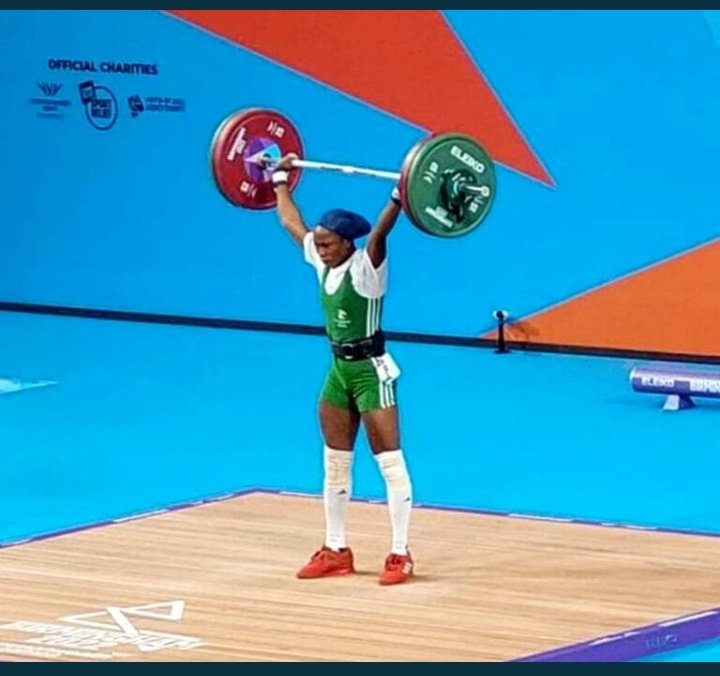 Let's appreciate our own with likes and retweets.. Her name is Adijat Adenike Olarinoye Wins Nigeria first Gold medal in Weightlifting setting a new world record of 203kg to win gold in women's 55kg.. 🥇🌟🎉🎉🎉🌹#BBNajia