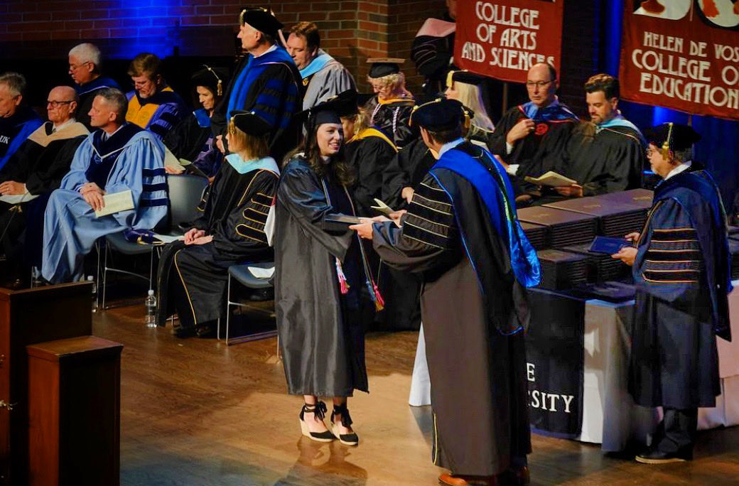 Meldenius's tweet photo. Many congratulations to all our Lee University summer graduates, especially those from the College of Arts &amp; Sciences. That’s me on the far right slinging diploma covers. 📸: ⁦@LeeUniversity⁩ https://t.co/kGYymAZgjZ