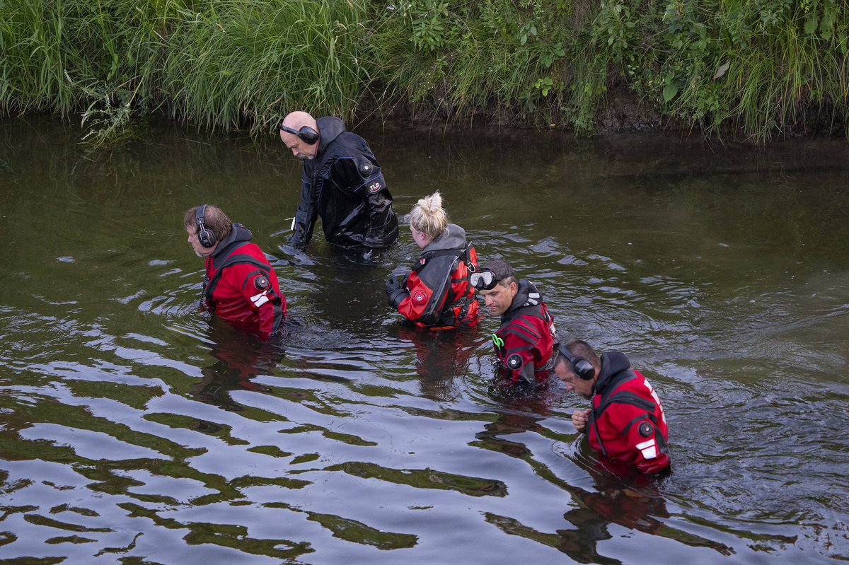 the Apple River with metal detectors after five people were stabbed while t...