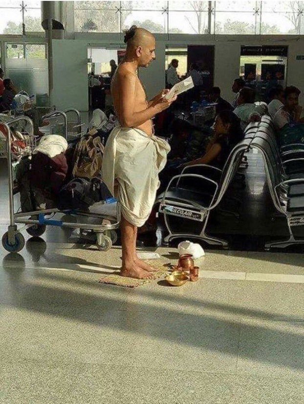 SaoirseAF's tweet photo. Unlike the staged Namaaz reading at #LuluMallLucknow , this is a picture of a Topless Bommin (complete with lota &amp; other accessories) offering prayers at an Airport Waiting Lounge! 

At the Airport, where there are designated prayer rooms!

Outrage anyone? 🤷‍♀️ https://t.co/03JeRPzpqB