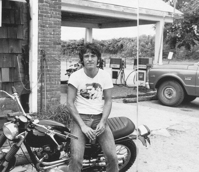 crockpics's tweet photo. Bruce Springsteen leaning on his motorcycle, 1970s https://t.co/X3gBK5A63R