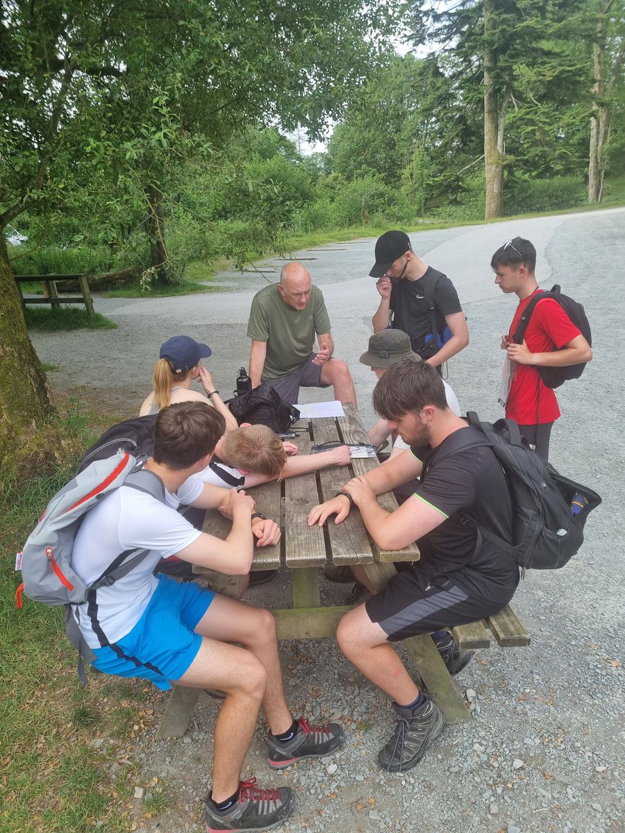 Gold DofE Day 2. Taking a rest in shade, planning the rest stops for the last half of the walk.
