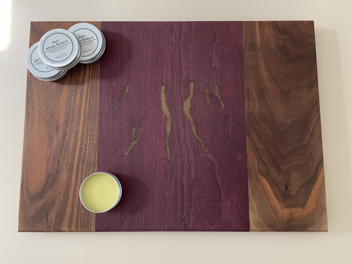 Finger lakes cutting board. This board features 6 of the finger lakes filled with a gold resin. The board is made from purpleheart and walnut. 

#MadeInUSA #SmallBusiness #wood #woodshop #woodworking #FingerLakes #lake