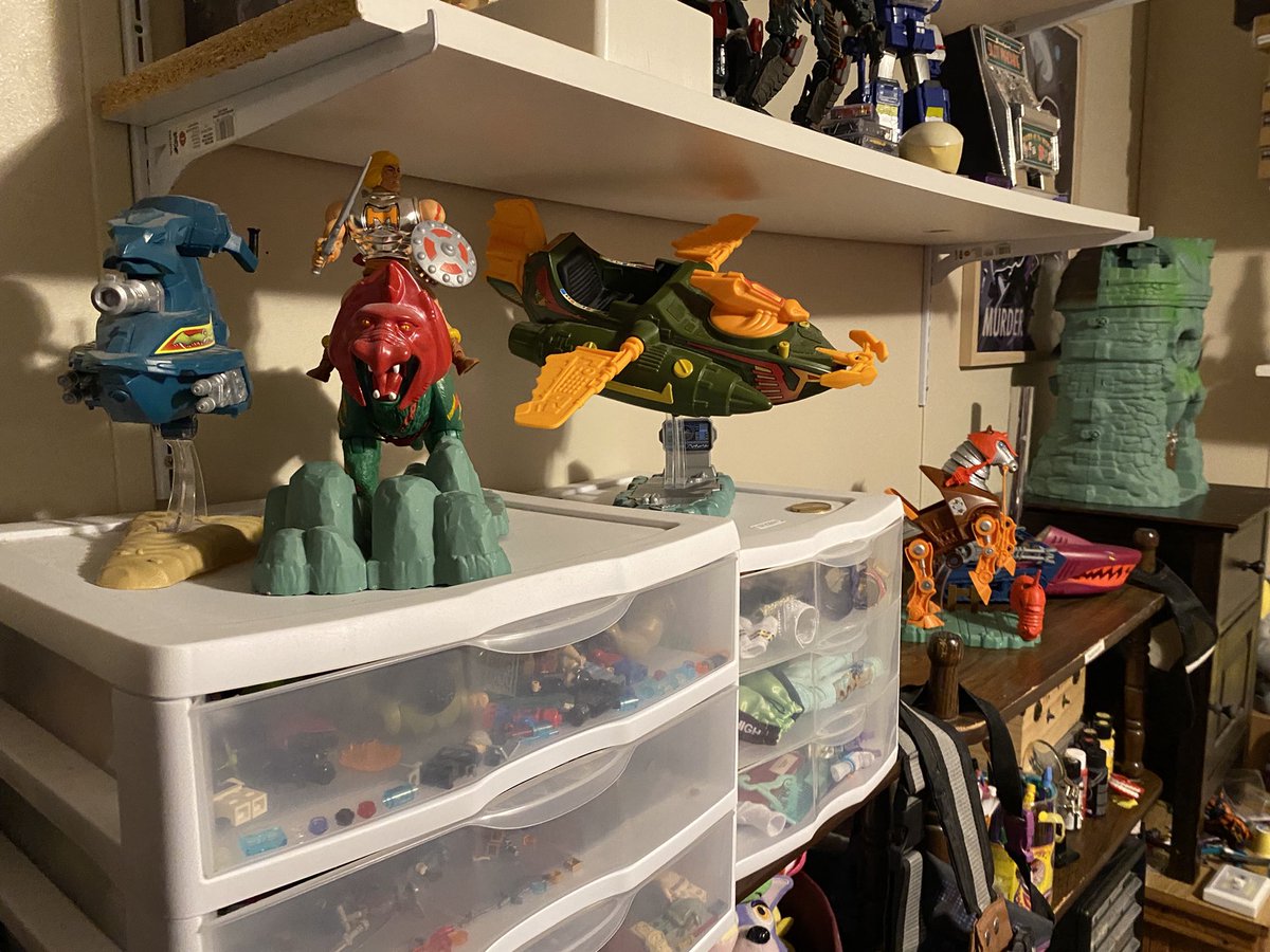 xXBKARXx's tweet photo. My current display of my MOTU Origins stuff. Everything around it’s a bit of a cluster fuck, but I’m working on it. #MOTUOrigins #CastleGrayskull #WindRaider #SkySled #LandShark #Stridor. My figures are in the little cabinet on my dresser. https://t.co/4rC6r9YInf