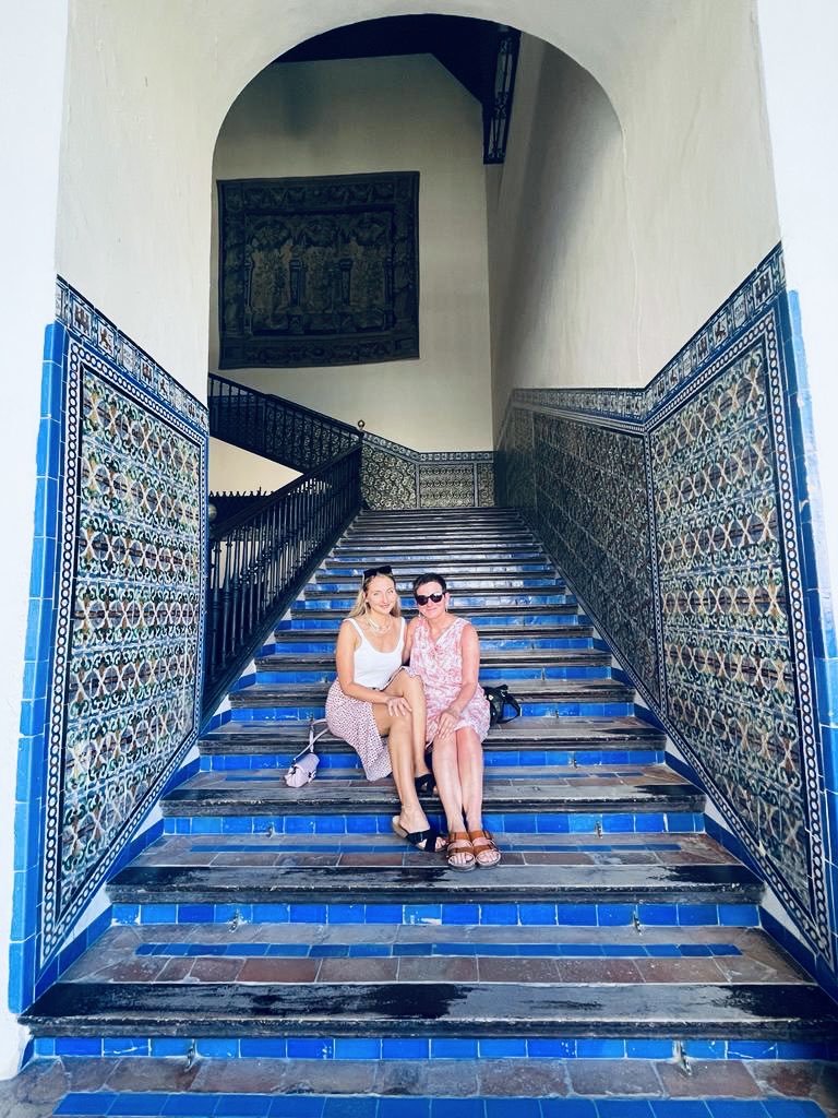 ProfDonnaHall's tweet photo. Spending a week with lovely ⁦@Lily__hall⁩ in the magical cultural melting pot of Seville. 
The blue of the steps in ⁦⁦@SevillaAlcazar⁩ is my favourite; a blend of Islamic, Jewish &amp; Christian influences over the centuries. Imagining all who’ve walked them before us https://t.co/aKzrdVOgVV