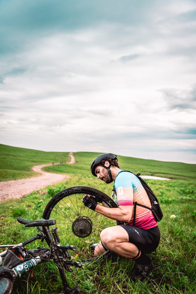 TylerTafelsky's tweet photo. A couple shots from @unboundgravel 200-mile in June 2022. Grateful for good legs, several spare tubes, and one epic ride through the #FlintHills of Kansas. #unboundgravel #gravelcycling https://t.co/Pm5krQa1NI