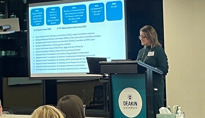 Prof Jo Salmon, director of Deakin IPAN, delivering a presentation about her research to an audience.