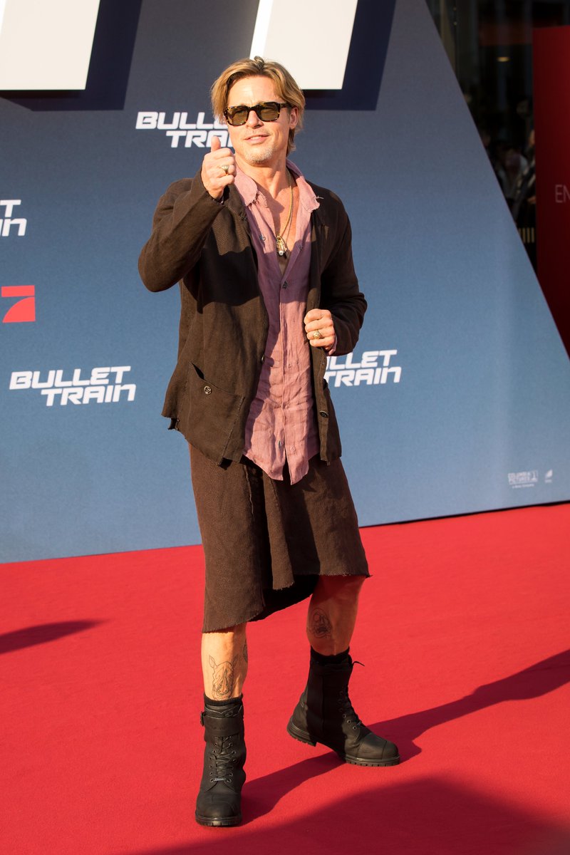 etalkCTV's tweet photo. Check out Brad Pitt showing off those leg tattoos in this skirt look on the #BulletTrain red carpet 👀❤️ https://t.co/gM314K7mU4