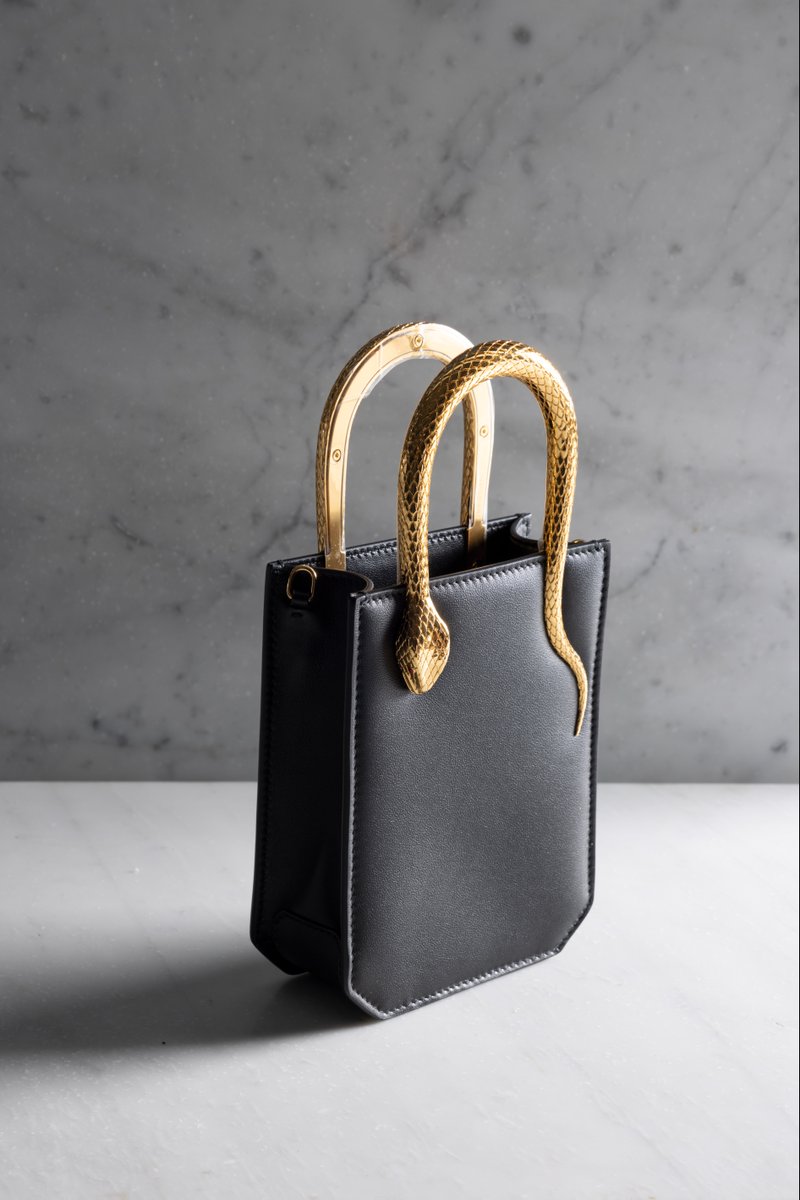Bulgariofficial's tweet photo. After expert care is taken over the finish of the bag’s exterior, #Serpenti’s metamorphosis into the Serpenti Vertical Tote is complete. Discover the end result of hours of craft at https://t.co/z4EDqQGw7B #BulgariAccessories #MadeInEden #FW22 https://t.co/hmaozGlR8E