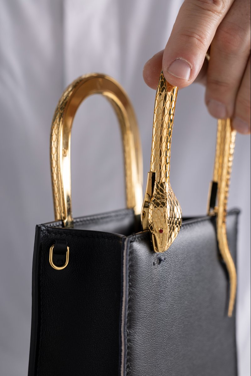 Bulgariofficial's tweet photo. After expert care is taken over the finish of the bag’s exterior, #Serpenti’s metamorphosis into the Serpenti Vertical Tote is complete. Discover the end result of hours of craft at https://t.co/z4EDqQGw7B #BulgariAccessories #MadeInEden #FW22 https://t.co/hmaozGlR8E