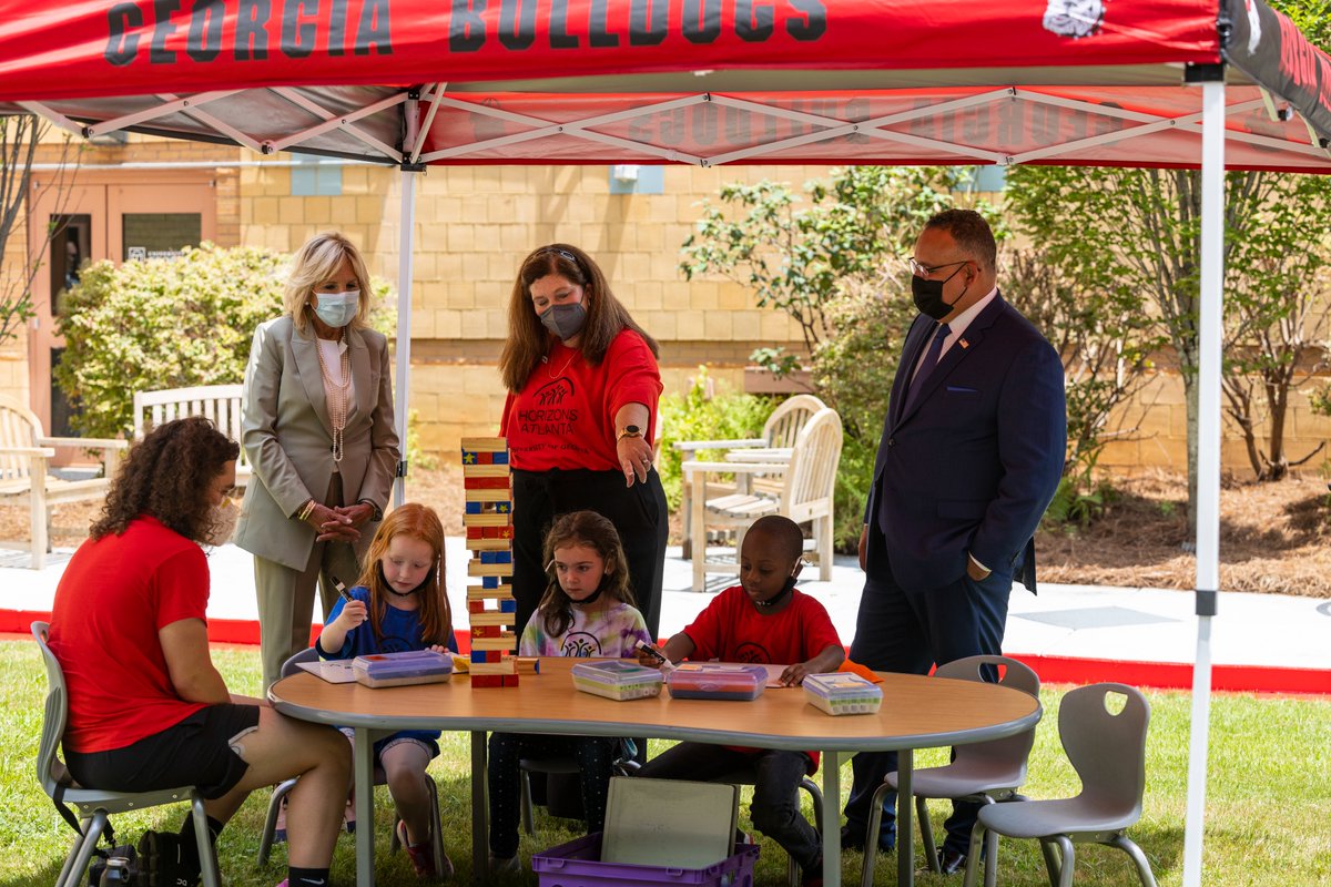 universityofga's tweet photo. .@FLOTUS Jill Biden visited UGA to learn more about a summer enrichment program hosted at the Ramsey Student Center. Dr. Biden and @SecCardona met with students and parents involved in the Horizons Atlanta program, which is offered to Athens schoolchildren through @ugamfecoe. https://t.co/85pNEMGFD0