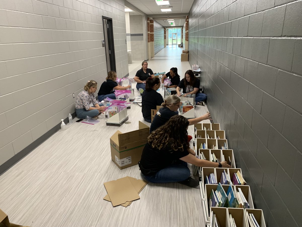 masmith1914's tweet photo. The ELA team and a few friends setting up the guided reading library at Gordon Reed K-6.  It’s starting to look and feel like a real school.  Exciting. https://t.co/8Rnx3vkMNX