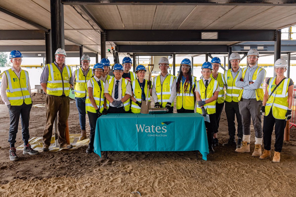 SallyKinchin's tweet photo. On the last day of term it was a double celebration at Harlington School.  Teachers and students buried a time capsule under the new library and Mrs Horrigan who has been Head Teacher for 17 years is retiring and was presented with an engraved spade.

@WatesGroup @Harlington_Sch https://t.co/V1XF6URkQ5
