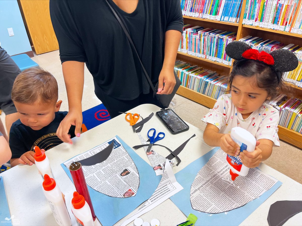 MDPLS's tweet photo. They’re ready for shark week! The kids used recycled newspapers and their creativity to make these jaw-some sharks during Craft Club at the Sunset Branch Library. #MDPLSSummerReading #OceansOfPossibilities https://t.co/cwyz1qX05W
