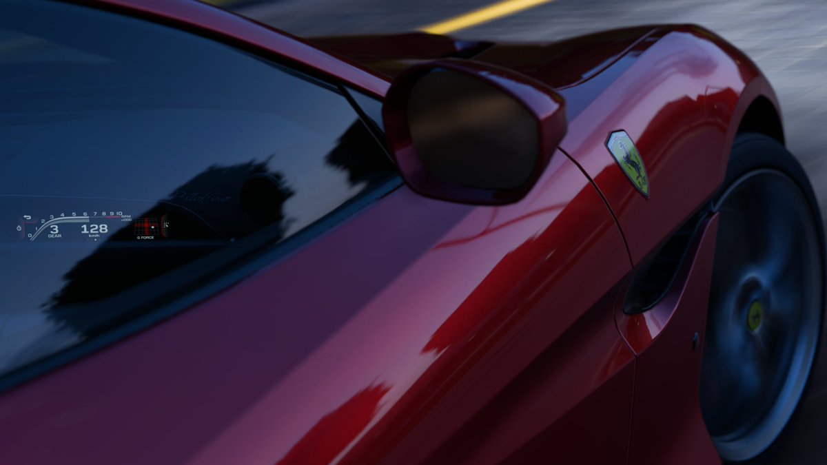 A Rosso Portofino 2018 Ferrari Portofino during the dusk hours drifting showing the driver's display. It's currently set at 6250 rpm in 3rd gear @ 128kph, and showing G-force being pushed to the bottom right. This photo was taken in Forza Horizon 5.