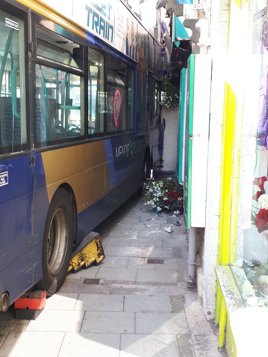 AnneRandall01's tweet photo. This was the scene at my office yesterday. Fortunately I was the only person working inside when a double decker bus hit the front of the building. The whole building shook and there was a terrible sound of breaking glass. The emergency services were quick to attend. https://t.co/btE64NGjfC