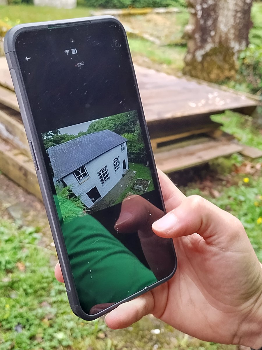 CapeliCymru's tweet photo. Sue and Jayne from @RC_Survey @RCAHMWales using a photopole to take aerial shots of Carmel, Nantmel, cool way to look at your gutters!
#CapeliCymru https://t.co/04EGtlsOqn