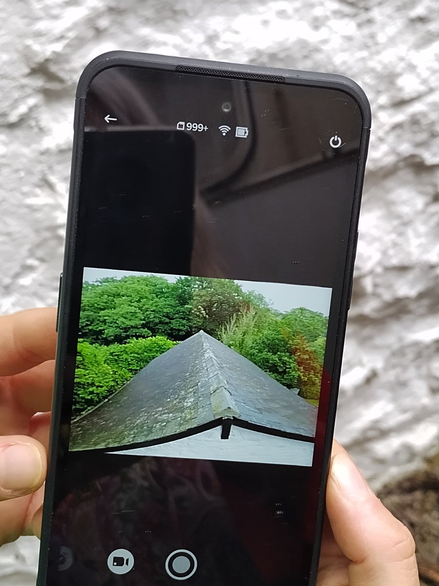 CapeliCymru's tweet photo. Sue and Jayne from @RC_Survey @RCAHMWales using a photopole to take aerial shots of Carmel, Nantmel, cool way to look at your gutters!
#CapeliCymru https://t.co/04EGtlsOqn