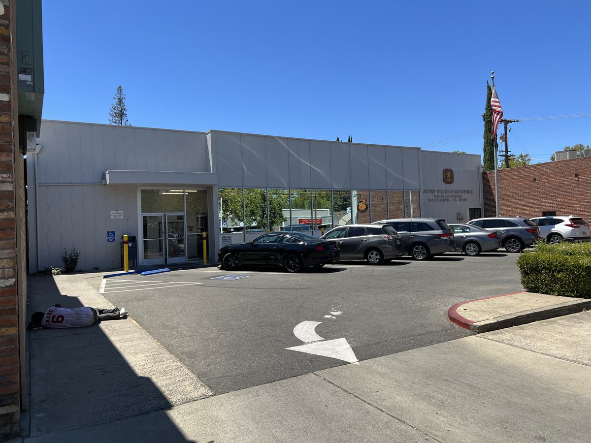 SacWalkSafe's tweet photo. #ladybird the movie featured our Camellia Station #uspostoffice. Today ⁦@TheCityofSac⁩ we have a poor man laying in the shade of the bank across the sidewalk. What are we doing to help him?  I think the answer is NOTHING https://t.co/KHNGd4xl8T