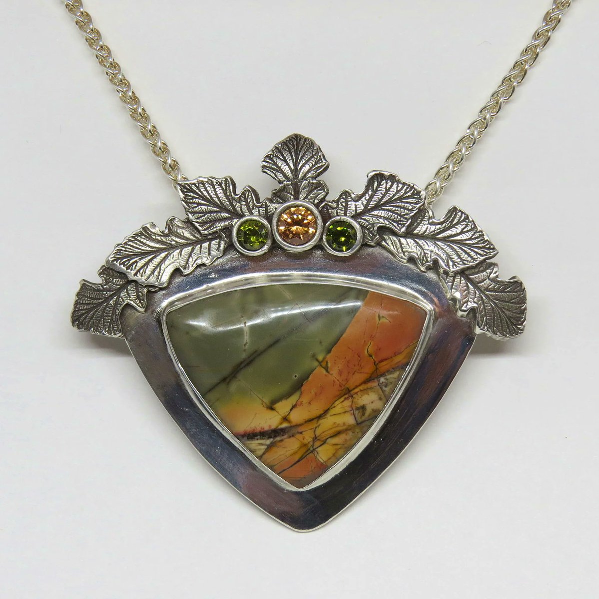 MetalClayToday's tweet photo. #Inspiration Our Spring 2016 Gallery featured some really impressive work. This pendant by Deborah Brooks titled Autumn Glory features silver clay, red creek jasper, and CZs and is a stunning example of metal clay mastery. 
#MCT #MetalClayToday #metalclay #artclay #PMC #art #oak https://t.co/JfiXEGrVHe