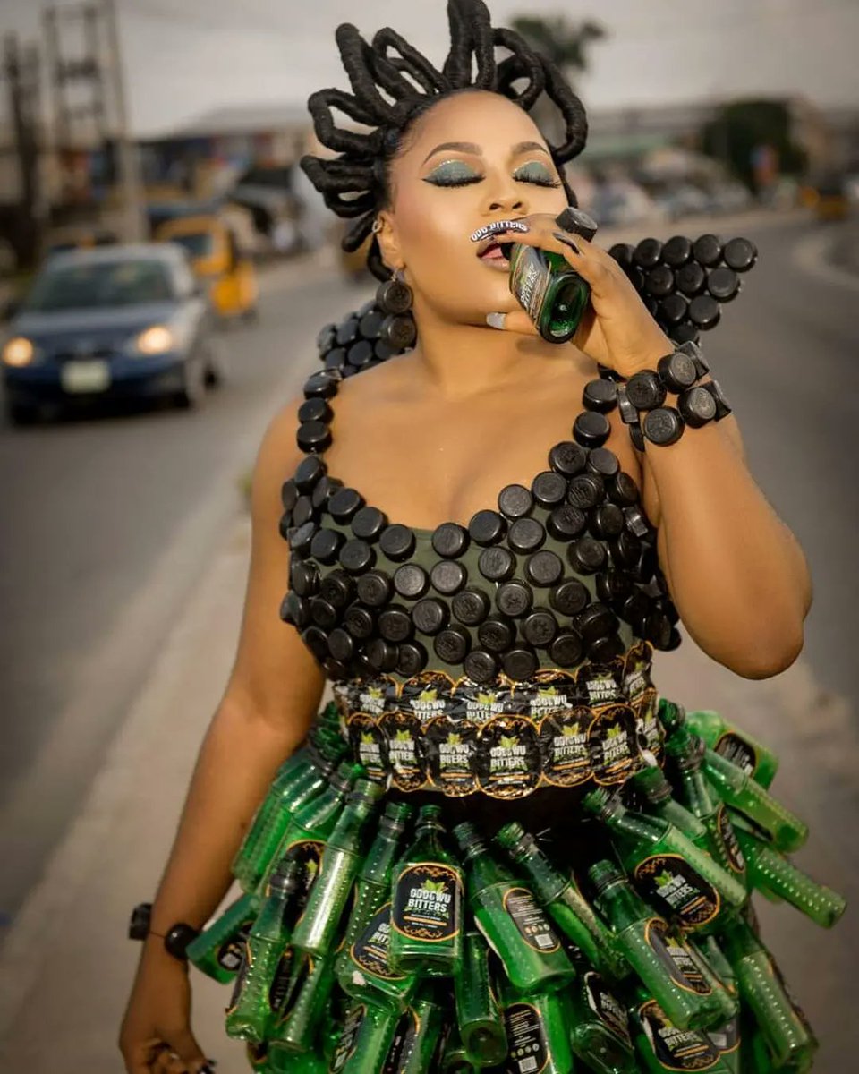 udosenoffical's tweet photo. Creativity at its best!
Nigerian lady makes an outfit using Odogwu Bitters plastic bottles.
How incredible is this?
👏👏👏👏
📸: soniatimz (Instagram)
#legitng #legitposts #fridaygoodness #FridayVibes https://t.co/Q7Akm8vCz8 https://t.co/rl48KqWuLN