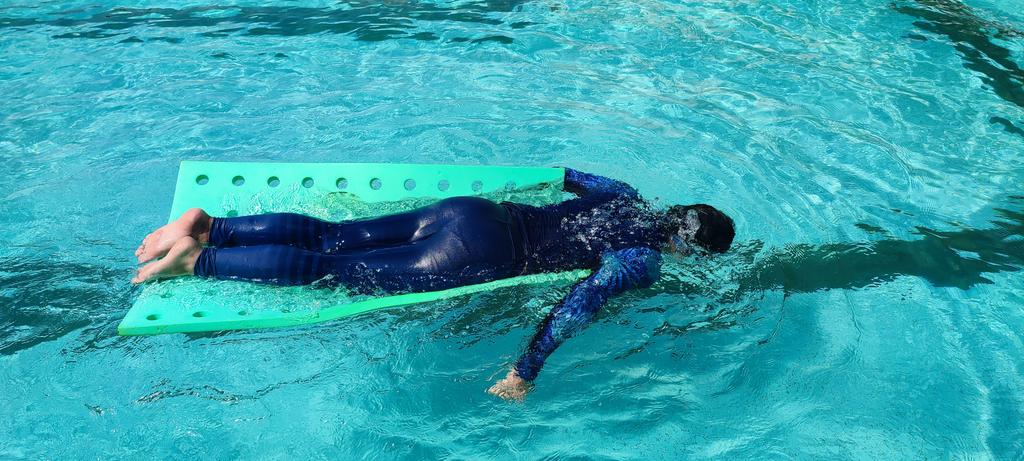 admutum's tweet photo. So happy that my son is back in the pool and enjoying himself, after almost 2 months. A few crying kids but he is ok. #autistic #AutismSwim https://t.co/h3rKNC0nbp