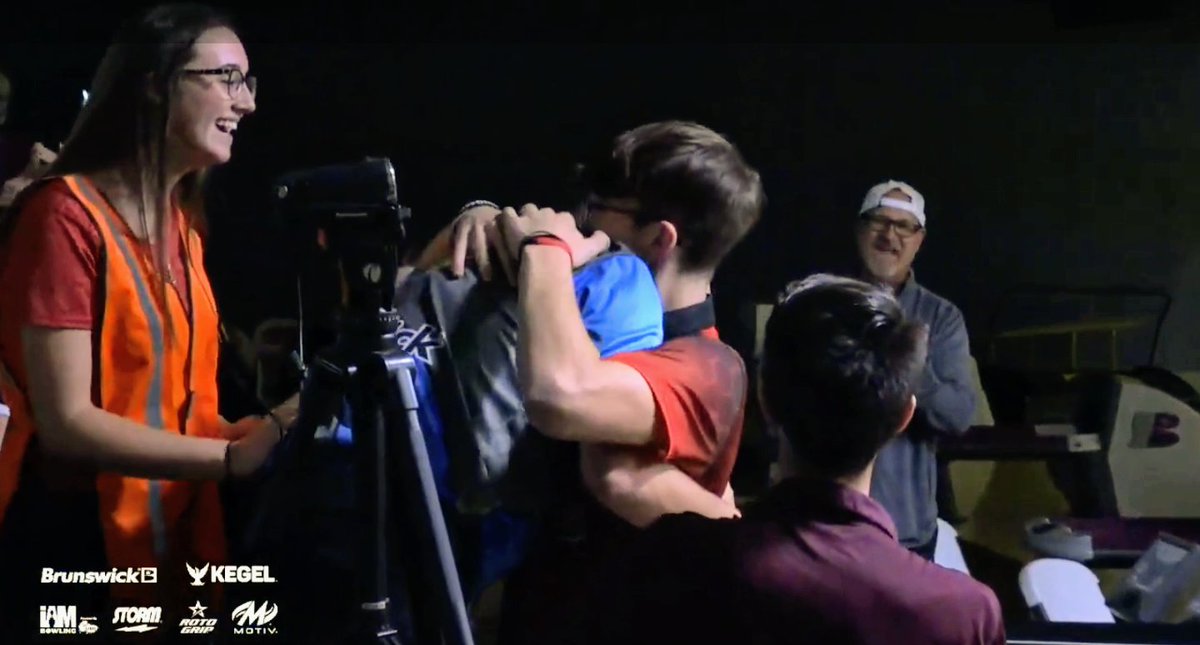 On the heels of his brother Justin's U20 Boys title days ago, Brandon Bohn gets a big hug from legendary dad Parker after winning back-to-back U18 Boys titles at the Junior Gold Championships, with sister Sydney left, brother Justin lower right, and uncle Doug Kent at upper right