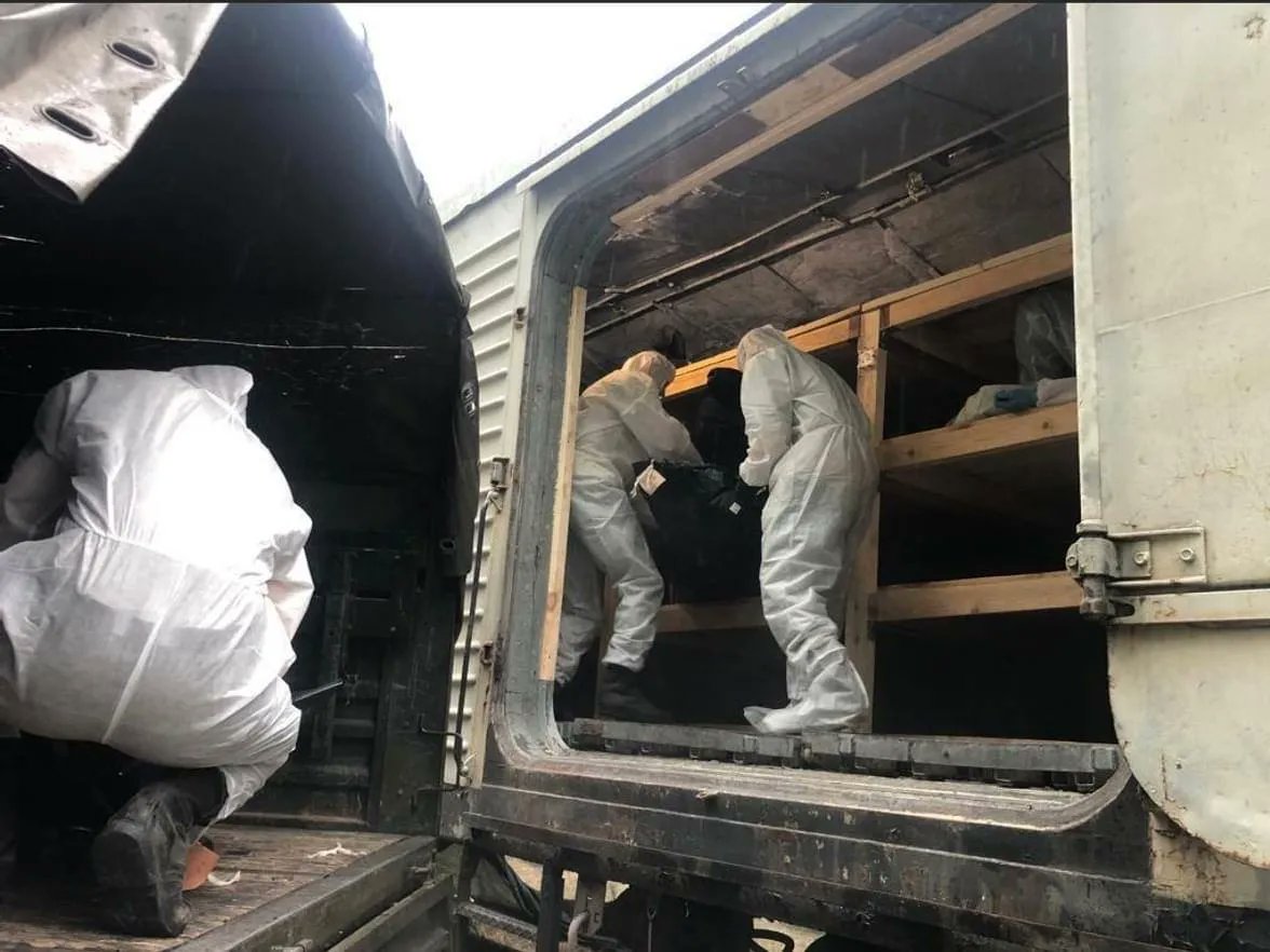DefenceU's tweet photo. Their final “black suits”. The bloody march of the russian occupiers ends like this. https://t.co/3hUdrxY17S
