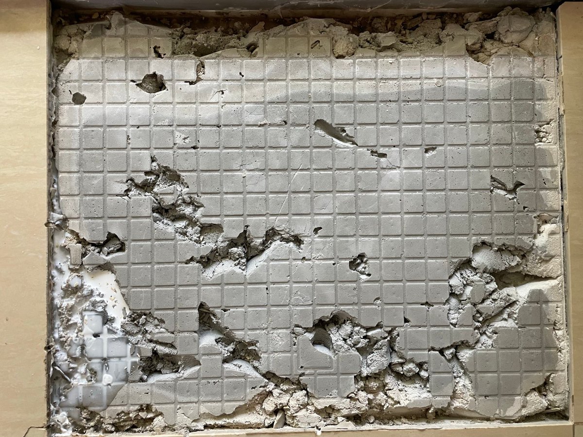 shanley_realtor's tweet photo. Why your porcelain tiles might be popping up -- if someone lays them on a concrete subfloor that looks like this, creating huge air pockets! #CrappyWork #PorcelainTile #NotMyJob https://t.co/FNYrQ8Xnz5