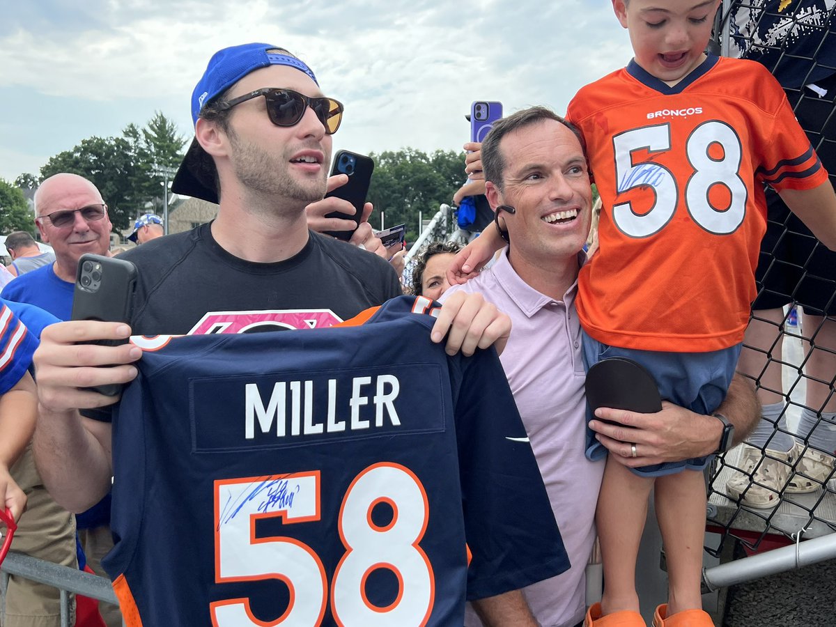 Bills DE Von Miller signing for fans. Both Bills and Broncos jerseys.