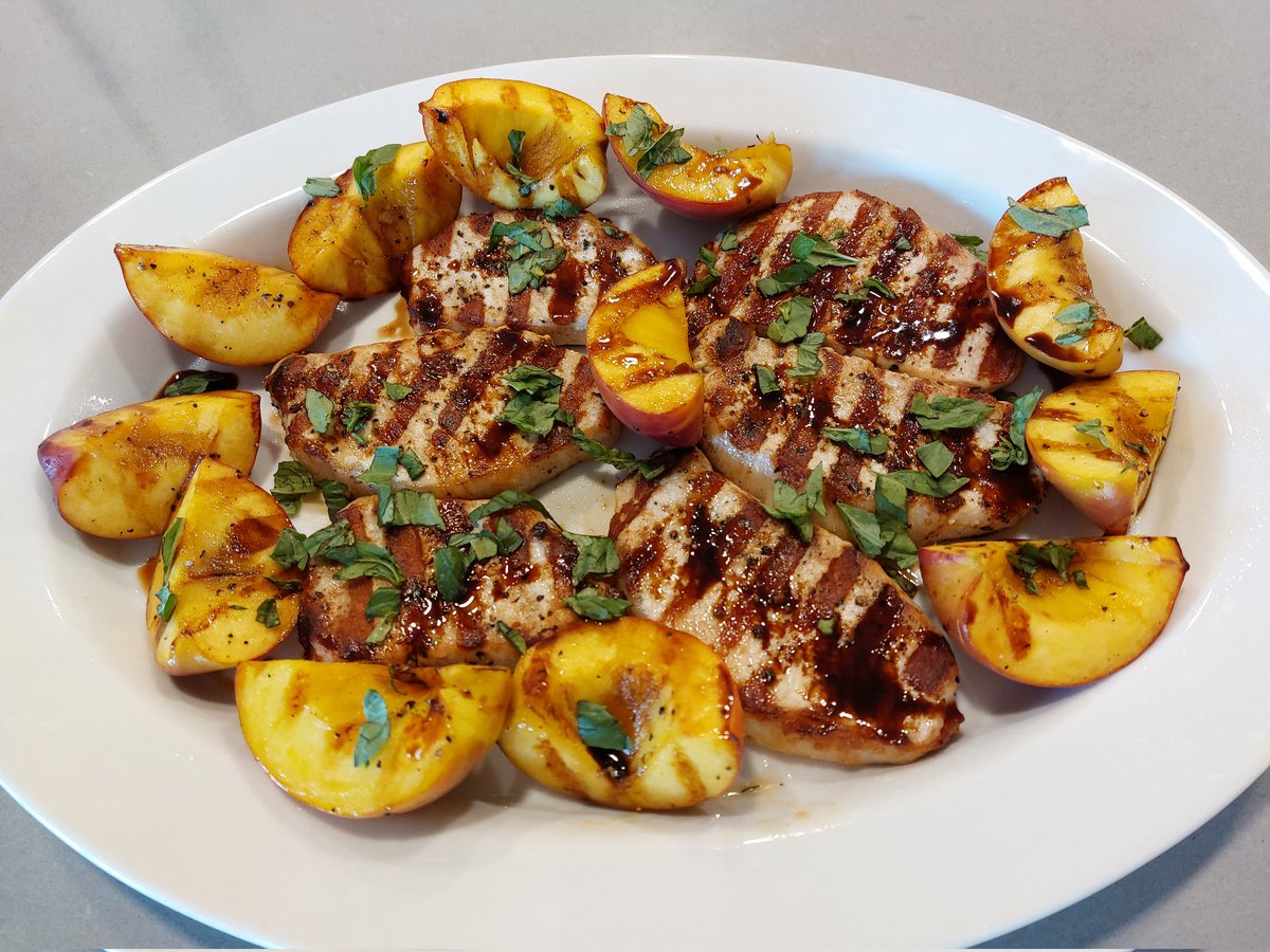 Grilled pork chops and peaches with balsamic vinegar and basil. Yum! #RetiredPrincipalInTheKitchen