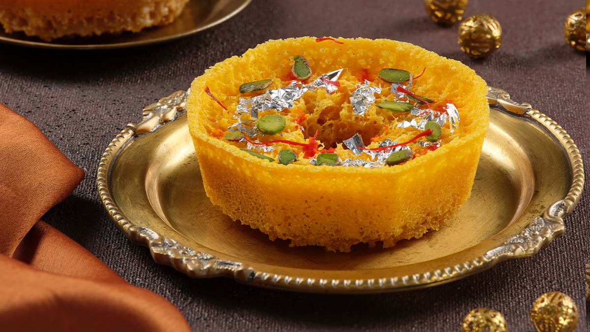 This luscious little piece of love needs no introduction. Savour Kesariya Ghewar and taste pure bliss. #Haldirams #Teej #Ghewar #KesariyaGhewar #Flavour #FlavoursOfGhewar #Festivity #Celebrations #TeejFestival