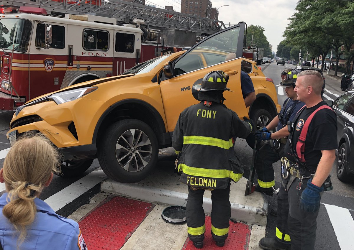 CSantucciPhoto's tweet image. A taxi got stuck atop one the new pedestrian safety fixtures along 21st Street and Broadway in #Astoria earlier today. Witnesses said that - very luckily - no one was seriously hurt. @NY1