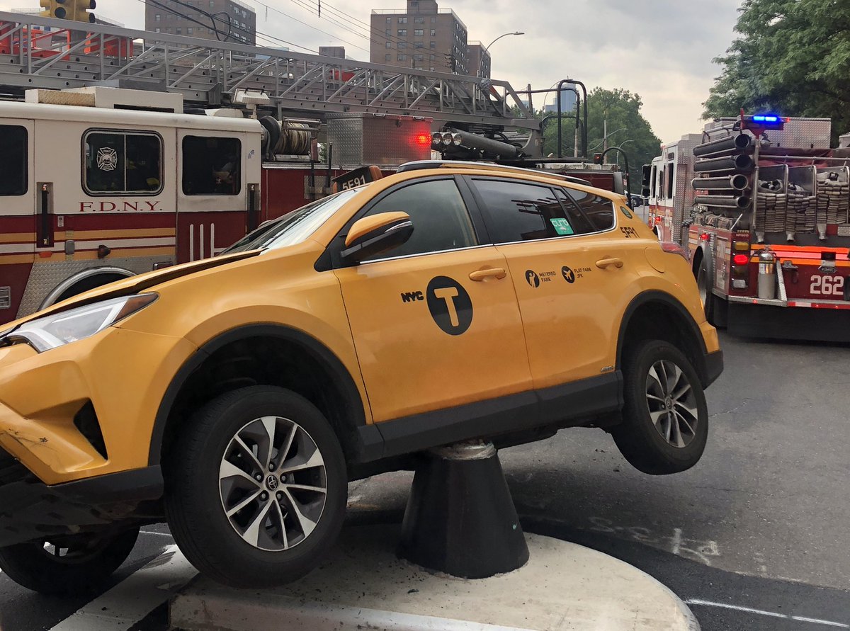 CSantucciPhoto's tweet image. A taxi got stuck atop one the new pedestrian safety fixtures along 21st Street and Broadway in #Astoria earlier today. Witnesses said that - very luckily - no one was seriously hurt. @NY1