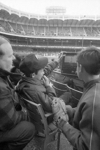 Watching the Apollo 13 blast-off from a portable tv during a game at Yankee Stadium, April 11, 1970.