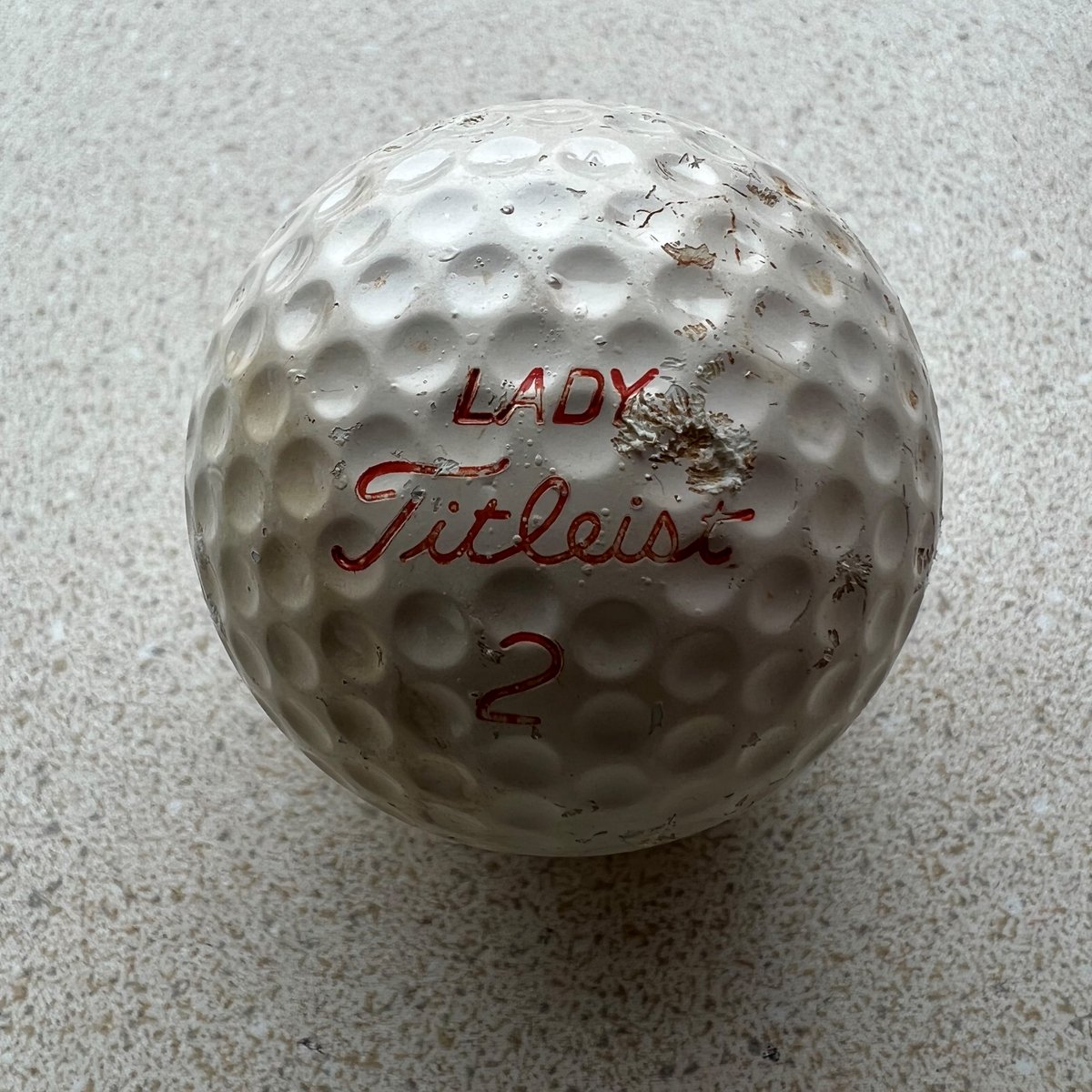 JoinMGCC's tweet photo. Would this be considered vintage? 🧐  We recently found a 42 year old golf ball on our course! {1980 Ladies Member-Guest}

#mgcc #marylandgolfandcountryclubs #marylandgolf #countryclublife #harfordcountymd #titleist https://t.co/iIU4mxI6eI