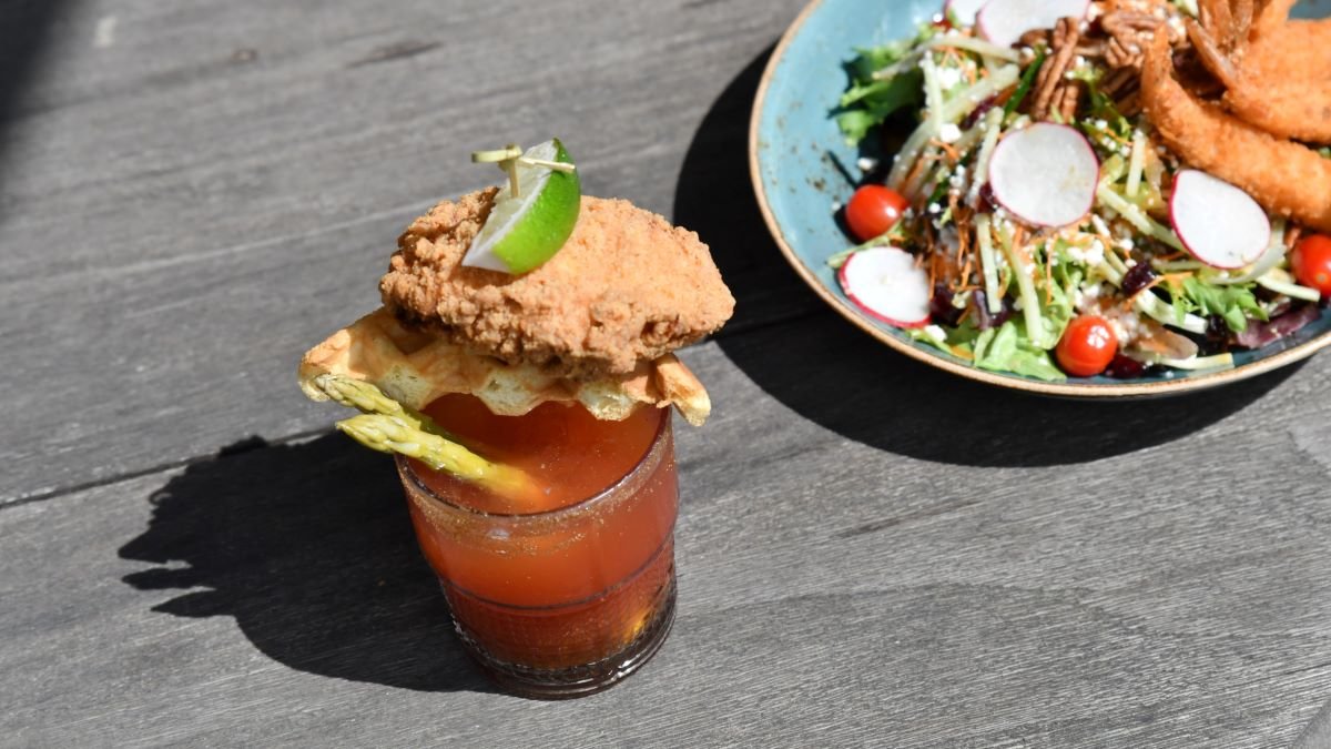 Join us for our summer Caesar series at Riverway Clubhouse while the sun’s still out🌞 
Here’s how it works: Choose your base, then your mixer, then your topper🧉 
Pictured: chicken &amp; waffle topper 🧇

Plan your perfect Caesar and reserve a table now: foodburnaby.ca/Riverway-drink…
