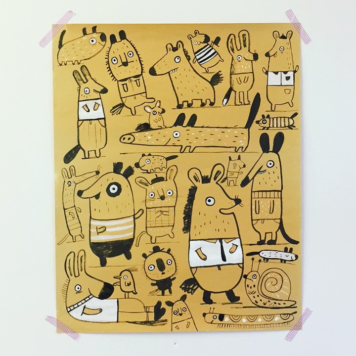 Drawing on a big bit of brown paper.