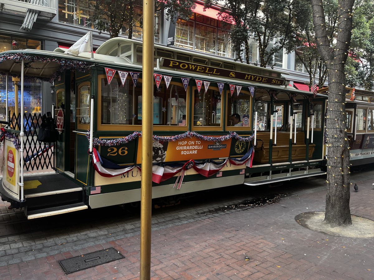 Walking by Maybelle the San Francisco cable car in line to turn around, still dressed for Independence Day, I made Disco hop up for a photo.

She's been renumbered from 526 to 26 and rebuilt along the way, but cling clang ... clingety clang, up and down and around she still goes.