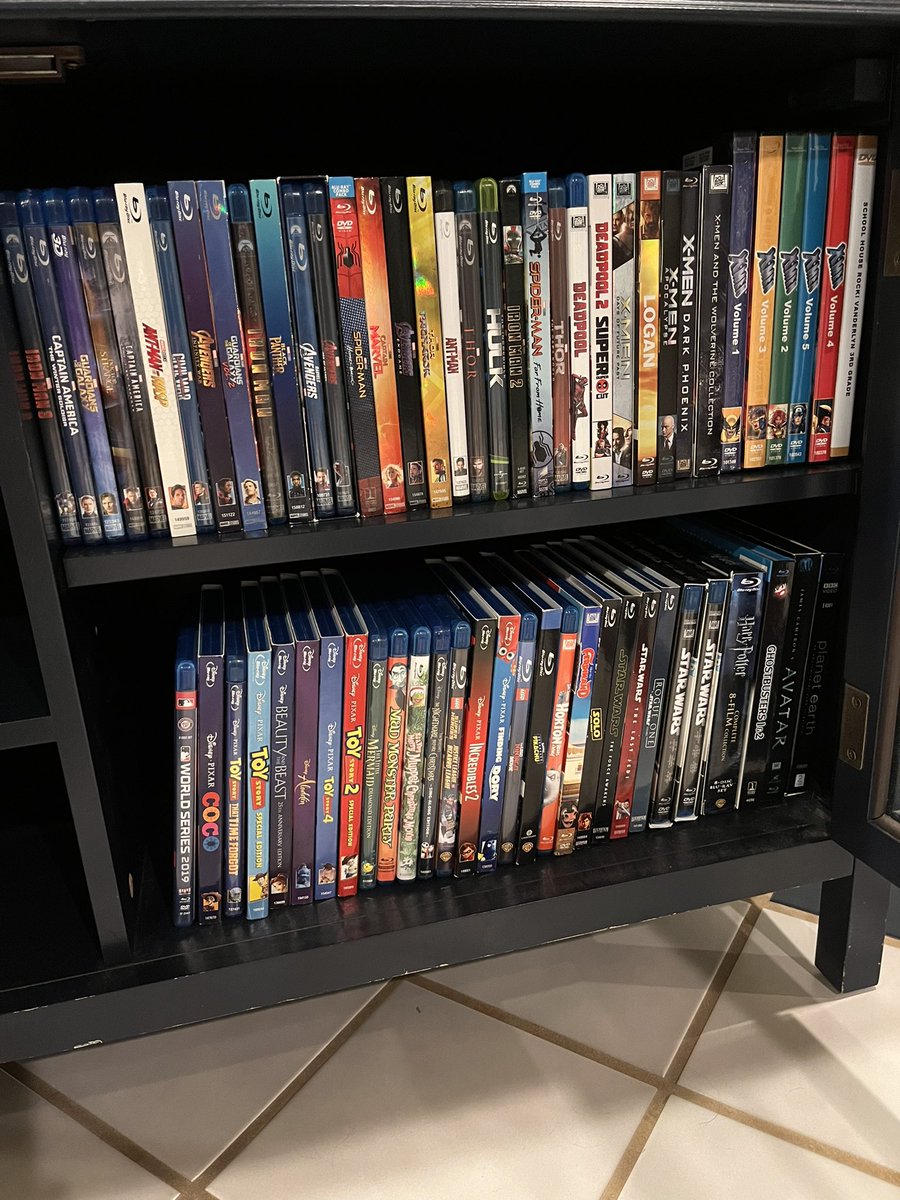 PhilNobblitt's tweet photo. My Vintage Disney+ Blu-ray account… No clue as to how much money I burned on these. Probably not as much as my Vintage HBO Max collection in the cabinet on the other side though. Anyone willing to estimate my losses? #depressingthoughts https://t.co/8MyvP67c5m