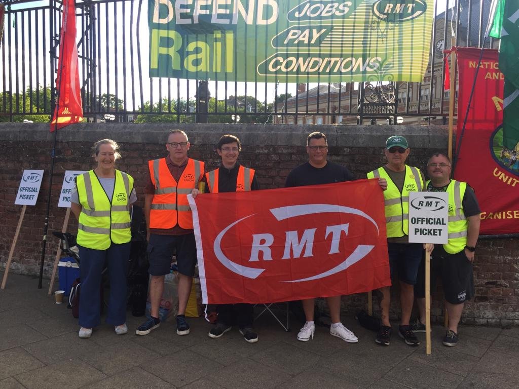 socialistworker's tweet photo. Solid on the picket line in Norwich this morning. Fighting for jobs, safety and action on the #CostOfLivingCrisis  #SupportRailWorkers #Solidarity #RailStrikes #RMT https://t.co/t9jovFnRqj