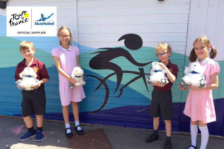 Our colleagues have added the finishing touch to a renovated sports shed at a primary school near Slough, in the UK – a <a href="/LeTour/">Tour de France™</a> cyclist. 💛 It’s a great way to mark <a href="/AkzoNobel/">AkzoNobel</a>'s role as an Official Supplier of the Tour de France – we love it! #TDF2022 #PeoplePlanetPaint