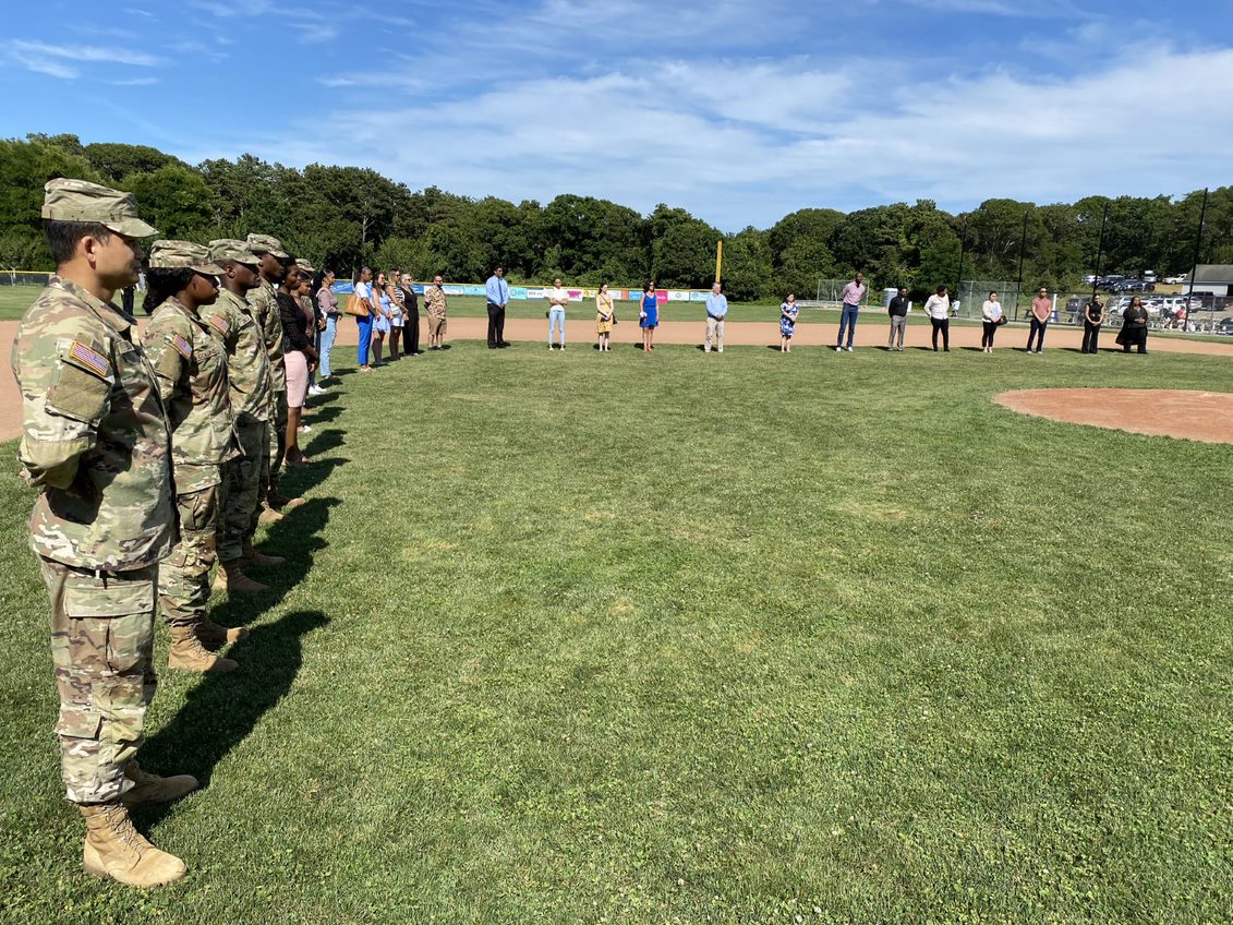 USCIS's tweet photo. Take me out to the ball game in Cape Cod where I can see 27 Massachusetts residents become #NewUSCitizens! This ceremony was part of @WhitecapsCCBL Military Appreciation Day. We were honored to have 7 #ServiceMembers among those sworn in. Sounds like a home run all around! https://t.co/0g2PDz3qGc