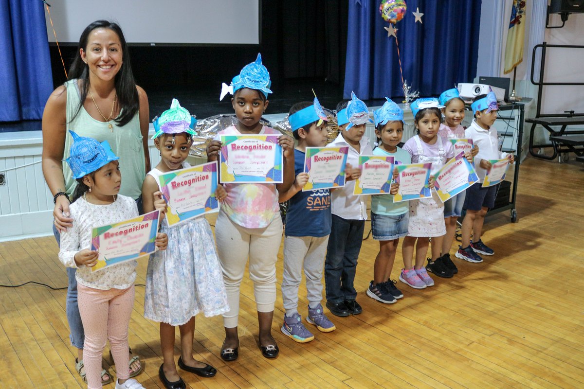 At Central Elementary School's summer showcase, "Animal Adaptions &amp; Habitats," administered by Ms. Lundy and staff, students received certificates, and families enjoyed a video of student work and the gallery walk of displays covering the Artic, the Rain Forest, and the Ocean.
