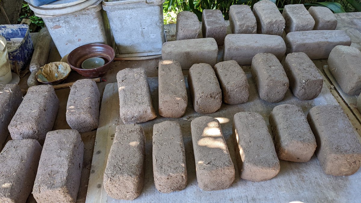 fired__earth's tweet photo. In a desperate attempt to get my #ExperimentalArchaeology #kiln over the line despite the #SydneyMonsoon and #floods I have been making #mudbricks - let's hope they dry. https://t.co/5vTqLiibHp