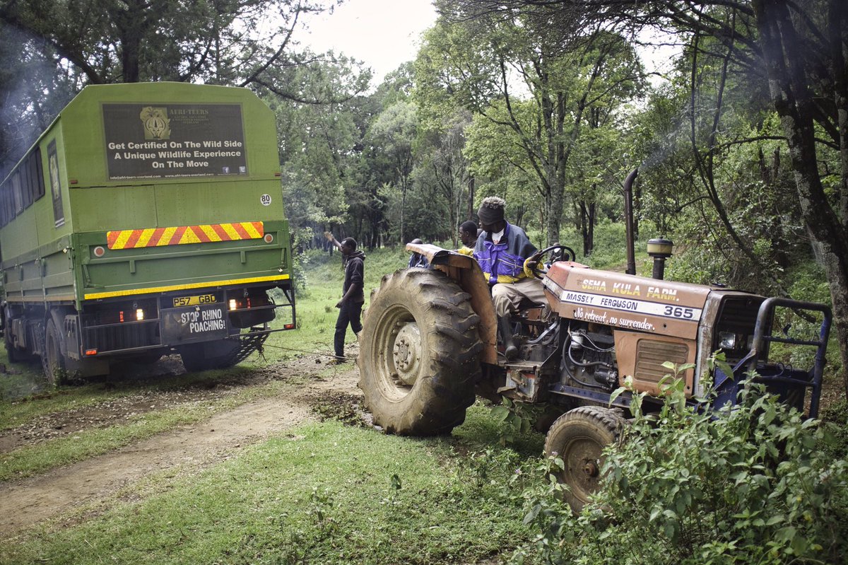 KeithUsherPhoto's tweet image. Supporting Conservation Initiatives. A friendly farmer uses his tractor to pull our truck out of the mud in the Kenyan highlands during a 3-month overland FGASA certification programme run by @CampfireAcademy in South Africa. #FGASA #Kenya #wildlifeconservation #overlanding