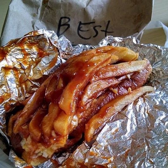 Polish Boy (Clevelend, OH) - kielbasa in a bun with barbecue sauce, french fries, and coleslaw