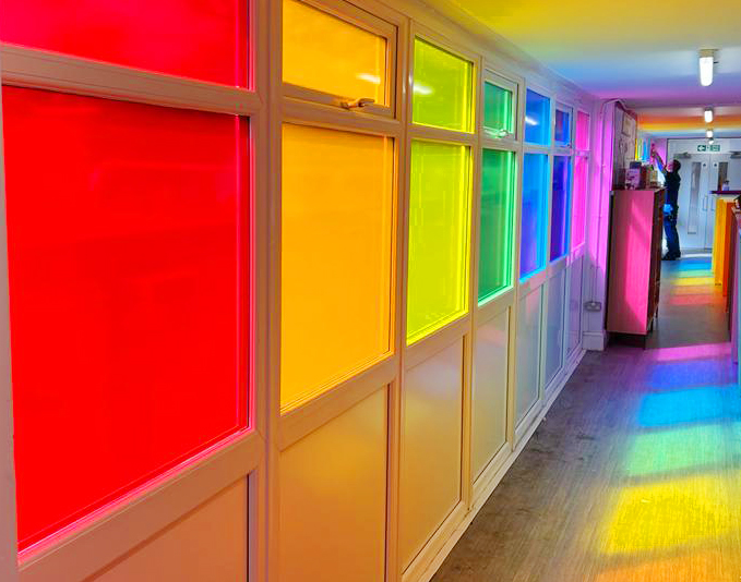 Before and after! Another beautiful rainbow corridor completed at <a href="/poultonstchads/">Poulton St Chad's CE Primary School</a> primary school. Such an amazing transformation! #windowvinyl #mactac #glazingfilms #rainbow 🌈